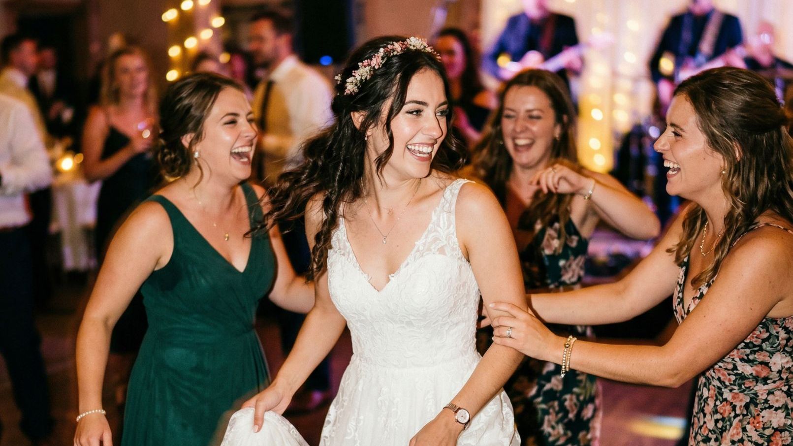 Bride dancing with friends at the reception